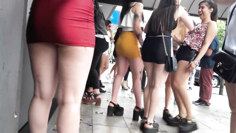 Public Mini Skirt Porn - Long-haired coed girl is wearing a red miniskirt in public | voyeurstyle.com