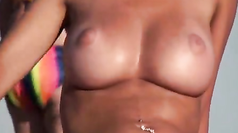 768px x 432px - Perfect natural tits get tanned at the beach | voyeurstyle.com