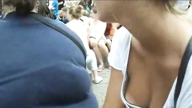 Peer down her shirt in public for a nipple voyeurstyle photo